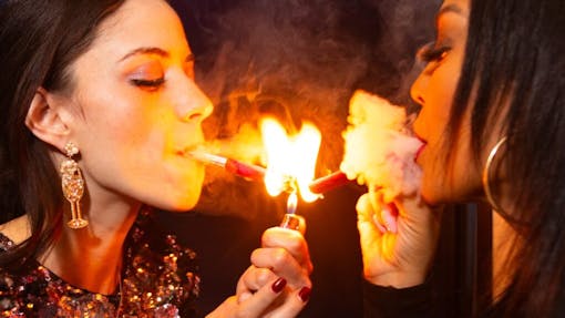 Pinks founder Ali Bianco sparks up a Pinks pre-roll Rose Blunt at Jue Lan Kitchen with Blunt Brunch co-founder Parisa Mansouri-Rad.
